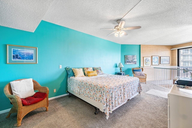 bedroom with a textured ceiling, carpet floors, and ceiling fan