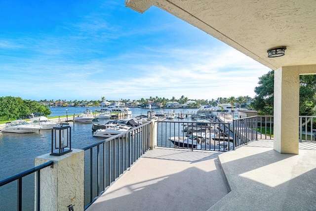 balcony featuring a water view