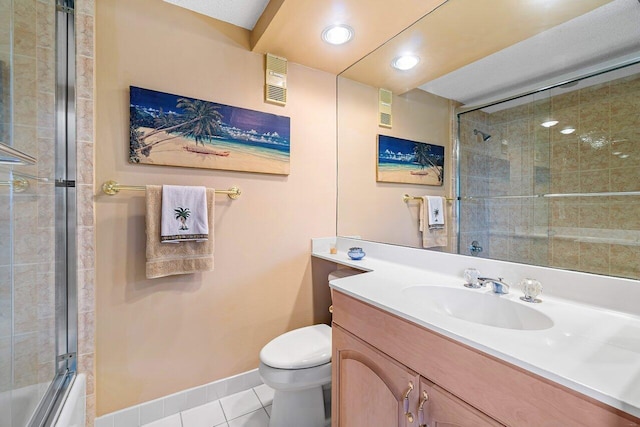 full bathroom featuring tile patterned flooring, vanity, enclosed tub / shower combo, and toilet