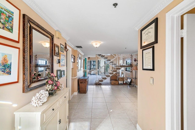 corridor featuring light tile patterned floors and crown molding