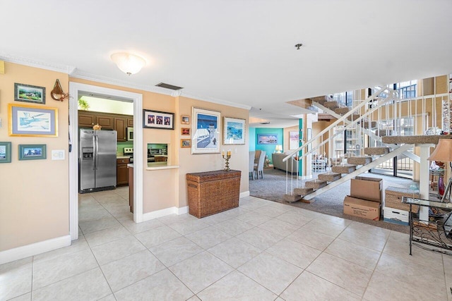 interior space with a wealth of natural light, stainless steel appliances, and ornamental molding