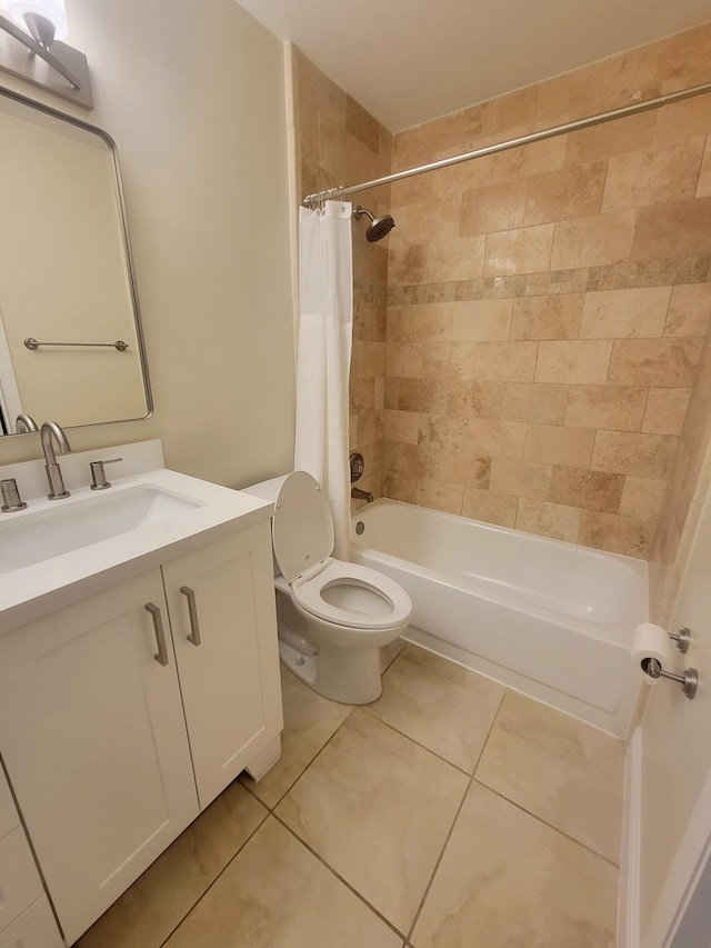 full bathroom featuring tile patterned floors, vanity, toilet, and shower / bath combo