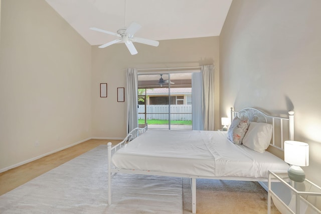 carpeted bedroom featuring vaulted ceiling and ceiling fan