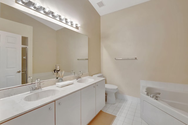 bathroom with tile patterned flooring, vanity, a tub to relax in, and vaulted ceiling