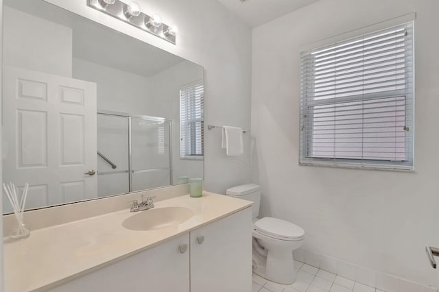 bathroom with toilet, vanity, tile patterned floors, and an enclosed shower