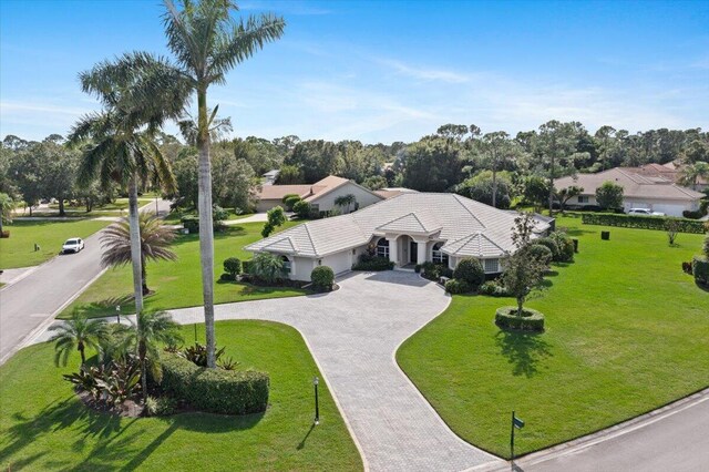 mediterranean / spanish house with a garage