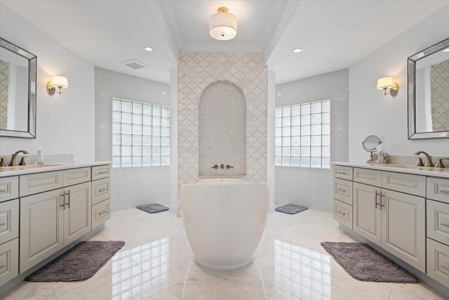 bathroom featuring vanity, tile patterned floors, and plenty of natural light