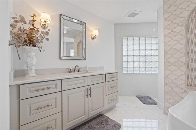 bathroom featuring tile patterned flooring and vanity