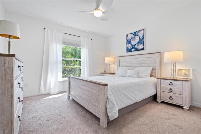 bedroom featuring ceiling fan and light carpet