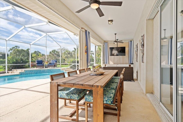 view of swimming pool with glass enclosure and a patio