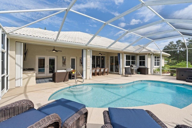 view of swimming pool featuring ceiling fan, french doors, a lanai, grilling area, and a patio area