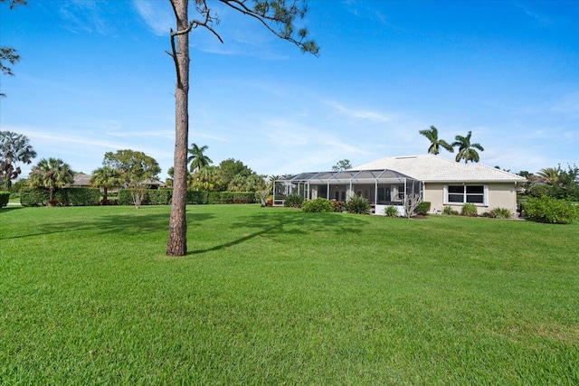 view of yard featuring glass enclosure