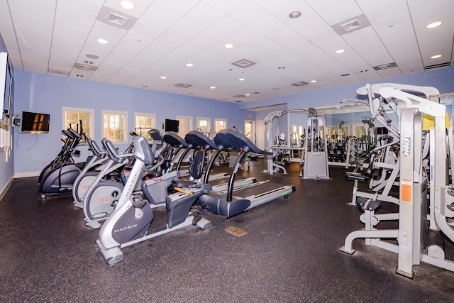 exercise room featuring a drop ceiling