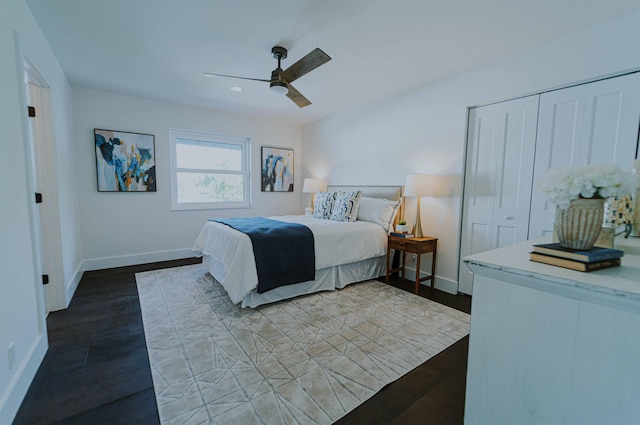 bedroom with ceiling fan, light hardwood / wood-style floors, and a closet