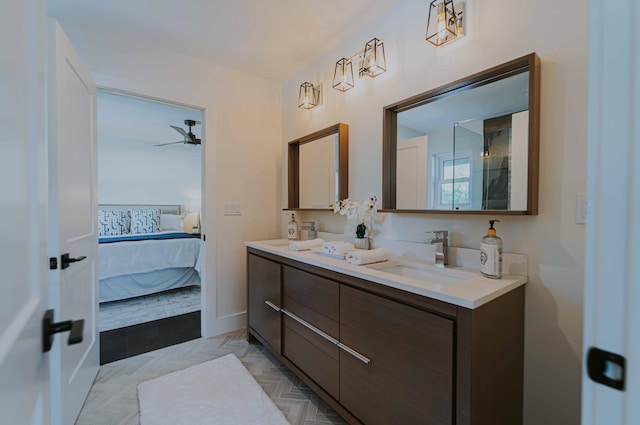 bathroom featuring ceiling fan, parquet flooring, and vanity