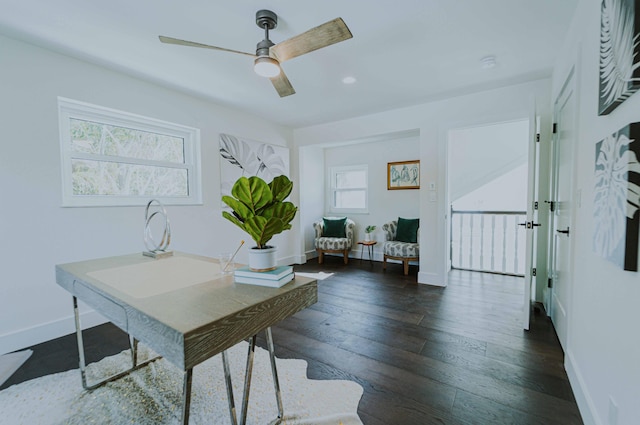 office with dark hardwood / wood-style flooring, ceiling fan, and a healthy amount of sunlight