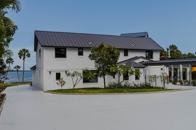 view of front of home with a water view