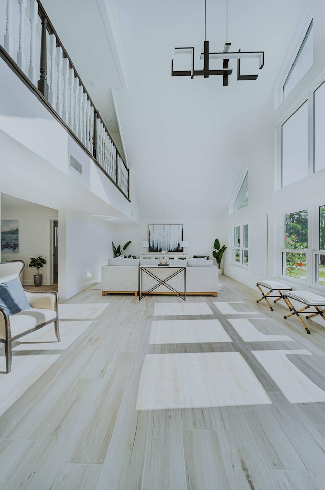 interior space with high vaulted ceiling and hardwood / wood-style flooring