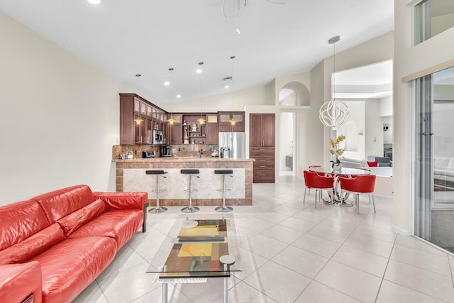 tiled living room with lofted ceiling