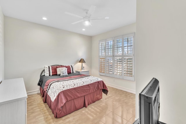 tiled bedroom featuring ceiling fan