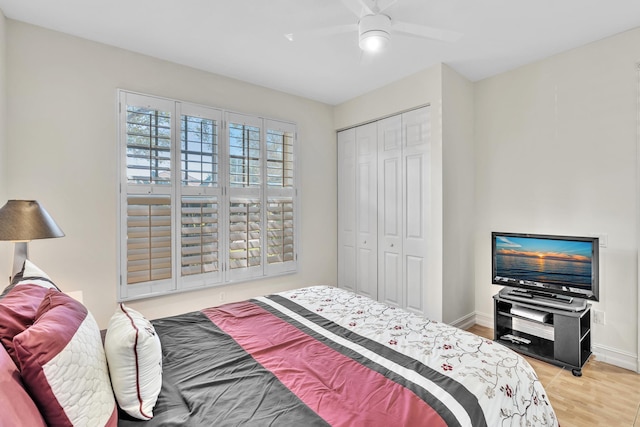 bedroom featuring a closet, hardwood / wood-style flooring, and ceiling fan