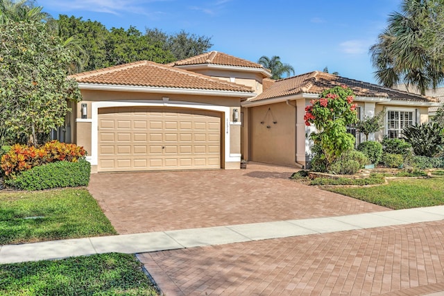 mediterranean / spanish house featuring a garage