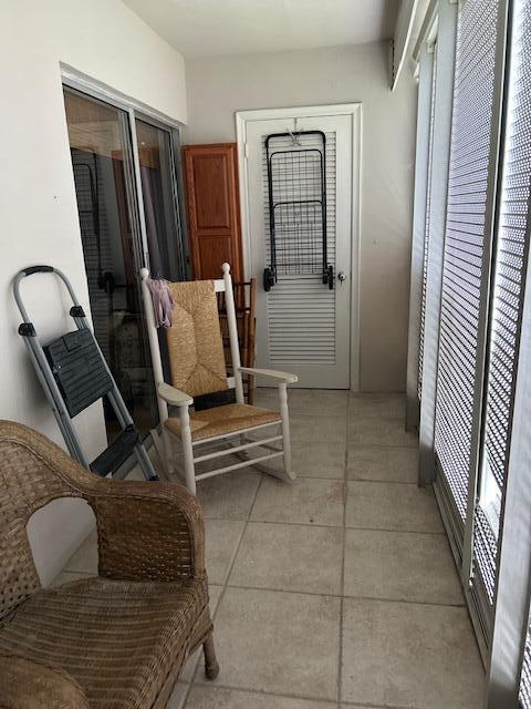 hallway with light tile patterned floors