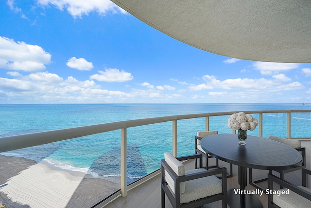 balcony featuring a water view