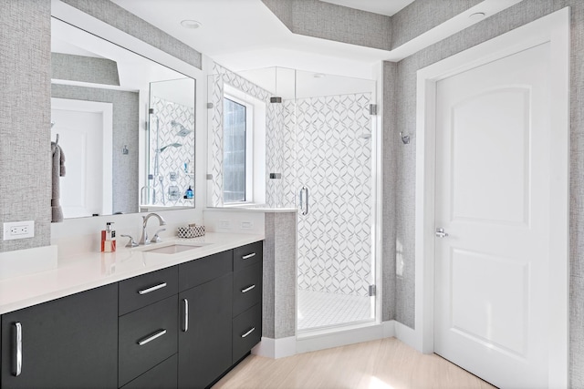 bathroom featuring vanity and walk in shower