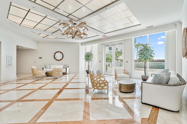 living room featuring a chandelier and ornamental molding