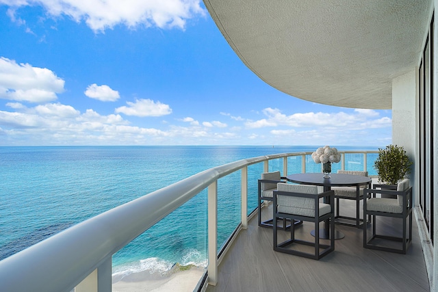 balcony featuring a water view