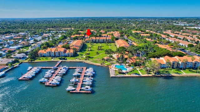 birds eye view of property with a water view