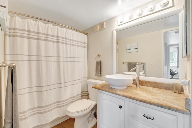 bathroom featuring walk in shower, vanity, and toilet