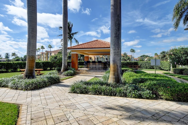 view of community featuring a gazebo and exterior bar