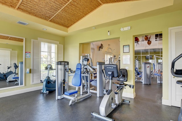 workout area with vaulted ceiling and wooden ceiling