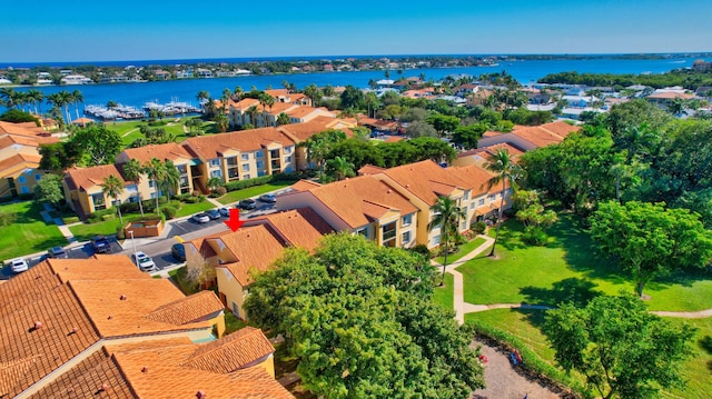 birds eye view of property featuring a water view