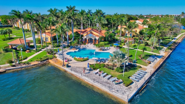 birds eye view of property with a water view