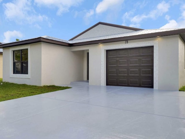 single story home with a garage