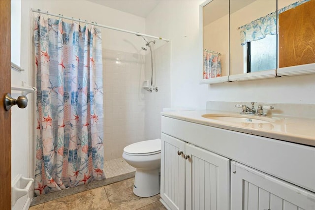 bathroom with tile patterned flooring, a shower with curtain, toilet, and vanity