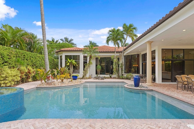 view of pool featuring a patio area