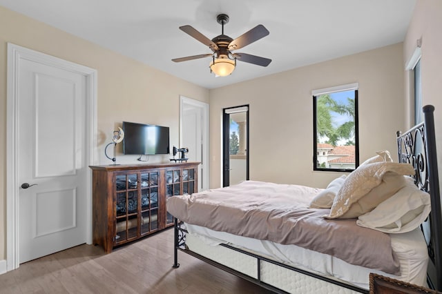 bedroom with ceiling fan and light wood-type flooring