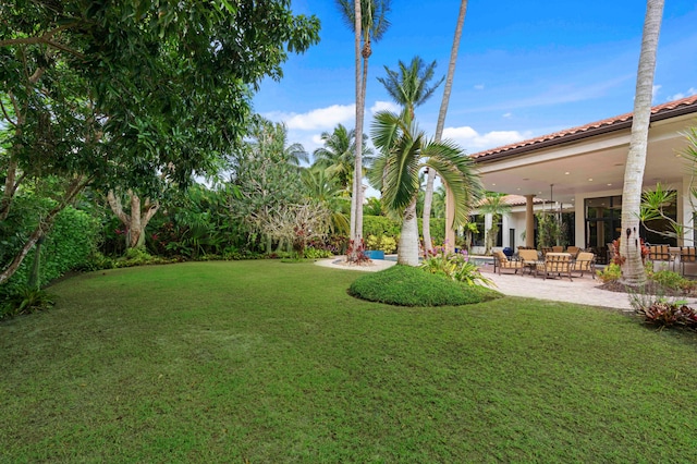 view of yard with an outdoor hangout area and a patio