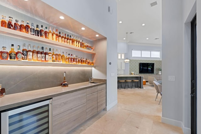 bar featuring backsplash, light tile patterned floors, crown molding, and wine cooler