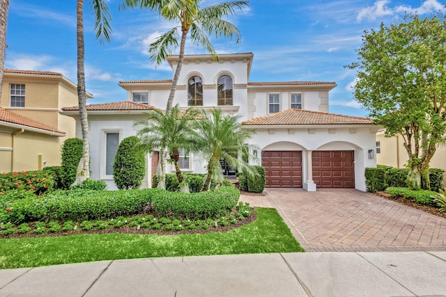 mediterranean / spanish-style house featuring a garage