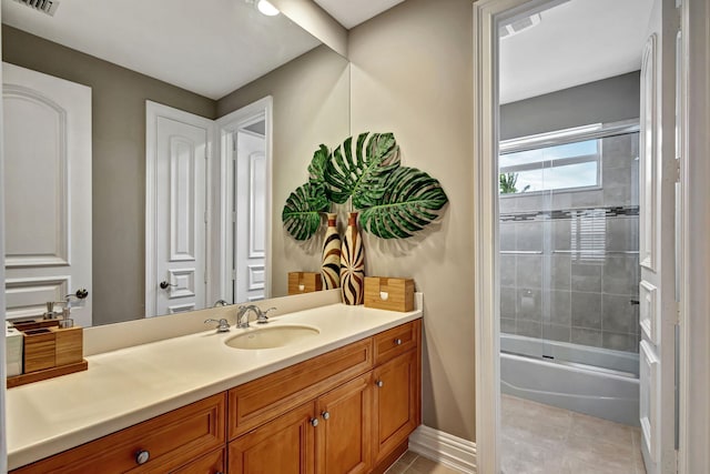 bathroom featuring vanity and enclosed tub / shower combo