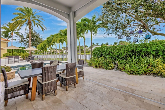 view of patio with a water view