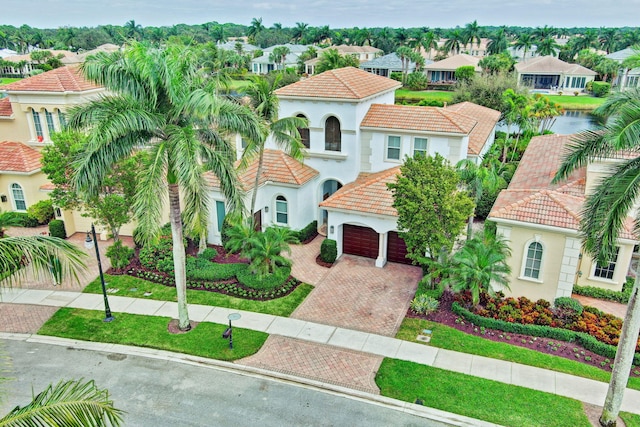 mediterranean / spanish-style home featuring a garage