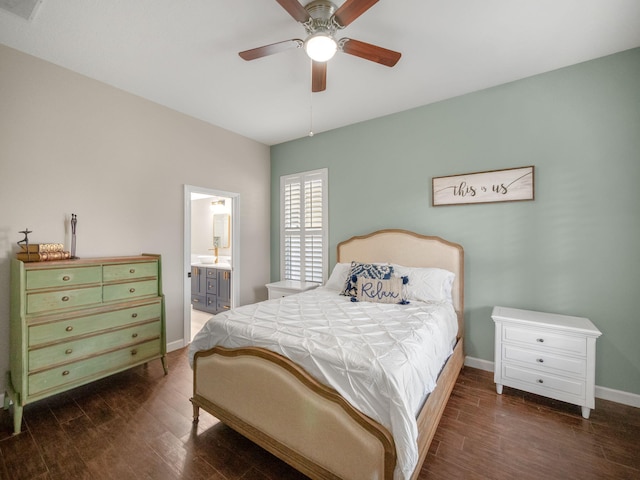 bedroom with dark hardwood / wood-style flooring, ensuite bath, and ceiling fan