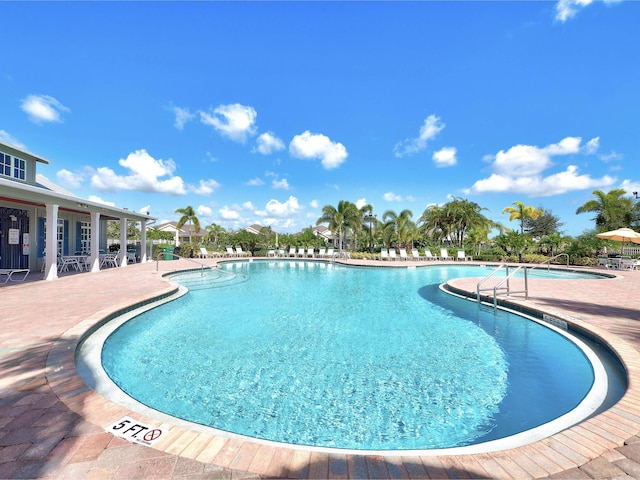 view of swimming pool featuring a patio