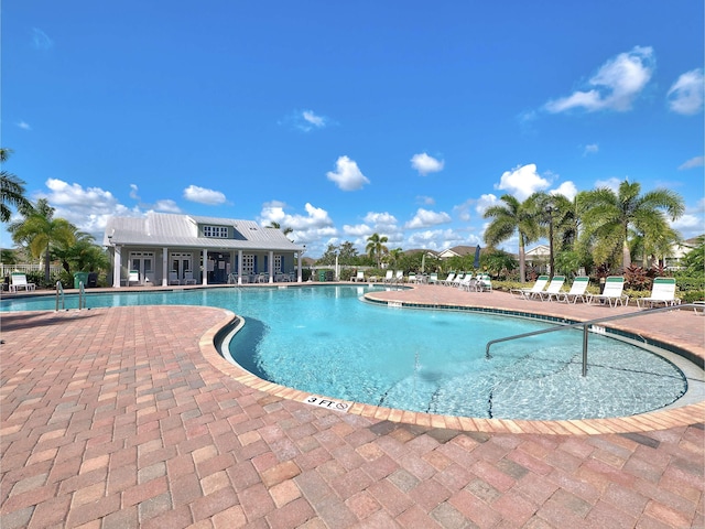 view of swimming pool with a patio area